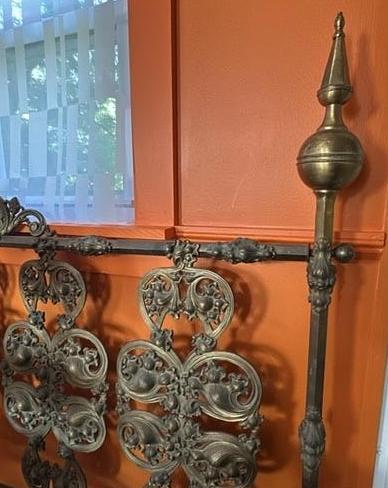 Brass headboard.